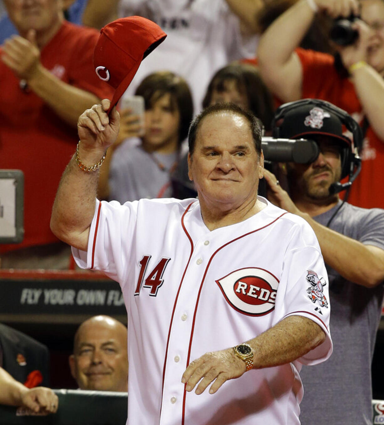 FILE - In this Sept. 6, 2013, file photo, former Cincinnati Red great Pete Rose walks onto the field during ceremonies honoring the starting eight of the 1975-76 World Champion Reds following a baseball game between the Cincinnati Reds and the Los Angeles Dodgers in Cincinnati. Major League Baseball Commissioner Rob Manfred said Thursday, April 23, 2015, that Rose will play some role during this summer's All-Star Game in Cincinnati.