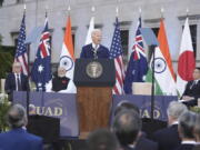 President Joe Biden, center &mdash; joined by Australian Prime Minister Anthony Albanese, Indian Prime Minister Narendra Modi and Japanese Prime Minister Fumio Kishida &mdash; speaks Saturday during a Quad leaders&rsquo; summit at Archmere Academy in Claymont, Del.