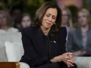 Democratic presidential nominee Vice President Kamala Harris listens to a parent&#039;s survivor story as she joins Oprah Winfrey at Oprah&#039;s Unite for America Live Streaming event Thursday, Sept. 19, 2024 in Farmington Hills, Mich.