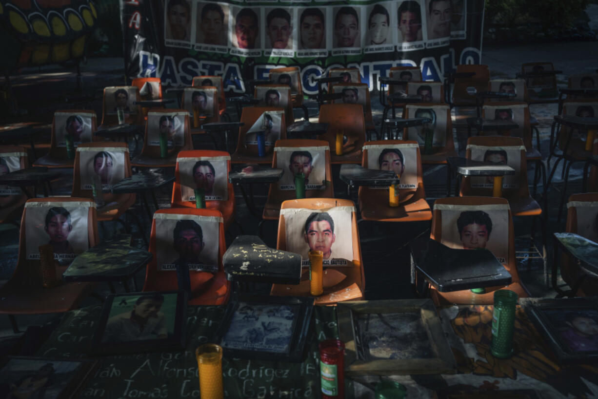 Photos of 43 students who have been missing for 10 years cover the stairs at their former Ra&uacute;l Isidro Burgos Rural Normal School in Ayotzinapa, Guerrero state, Mexico, Saturday, Aug. 24, 2024.