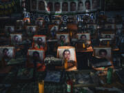 Photos of 43 students who have been missing for 10 years cover the stairs at their former Ra&uacute;l Isidro Burgos Rural Normal School in Ayotzinapa, Guerrero state, Mexico, Saturday, Aug. 24, 2024.