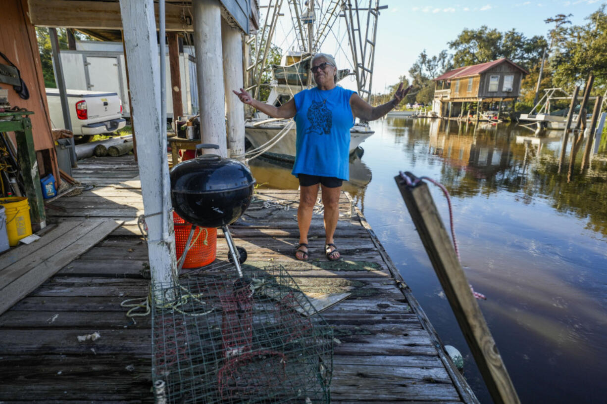 Debra Matherne describes her experience as she rode out Hurricane Francine the previous night, along Bayou Pointe-au-Chien, La., Thursday, Sept. 12, 2024.