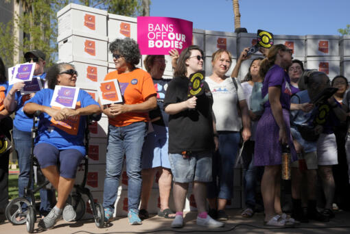 FILE - Arizona abortion-rights supporters gather for a news conference prior to delivering over 800,000 petition signatures to the capitol to get abortion rights on the November general election ballot, July 3, 2024, in Phoenix. (AP Photo/Ross D.