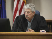 FILE - South Central District Judge Bruce Romanick listens to arguments by attorneys during a hearing challenging North Dakota&#039;s abortion laws, July 23, 2024, in Bismarck, N.D.