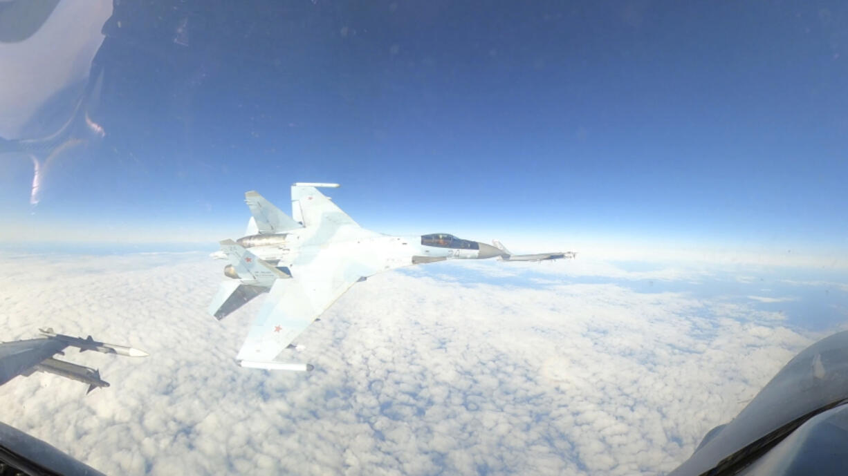 In this Sept. 23, 2024, image taken from video, a U.S. Air Force F-16 operating under the direction of North American Aerospace Defense Command, conducts a routine intercept of a Russian Tu-95 aircraft in the Alaskan Air Defense Identification Zone (ADIZ) when NORAD said a Russian Su-35 aircraft conducts an unsafe maneuver directed at the F-16.