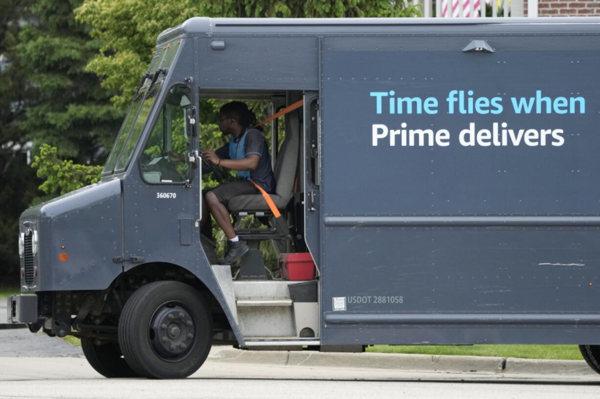 FILE - An Amazon truck makes deliveries in Wheeling, Ill., May 16, 2024. (AP Photo/Nam Y.