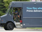 FILE - An Amazon truck makes deliveries in Wheeling, Ill., May 16, 2024. (AP Photo/Nam Y.