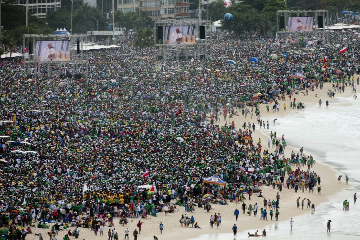 FILE - Crowds attend the World Youth Day&#039;s closing Mass line the shore of Copacabana beach in Rio de Janeiro, on July 28, 2013. An estimated 3 million people poured onto the beach for the final Mass of Pope Francis&#039; historic trip to his home continent, cheering the first Latin American pope in one of the biggest turnouts for a papal Mass in recent history.