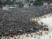 FILE - Crowds attend the World Youth Day&#039;s closing Mass line the shore of Copacabana beach in Rio de Janeiro, on July 28, 2013. An estimated 3 million people poured onto the beach for the final Mass of Pope Francis&#039; historic trip to his home continent, cheering the first Latin American pope in one of the biggest turnouts for a papal Mass in recent history.