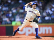 Seattle Mariners starting pitcher Logan Gilbert throws against the Oakland Athletics during the first inning Sunday in Seattle.