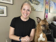 Lindsay Kee, seen Aug. 3 with her dog Teddy Ruffsavel at her home in Portland, created an exercise routine around walking her dog.