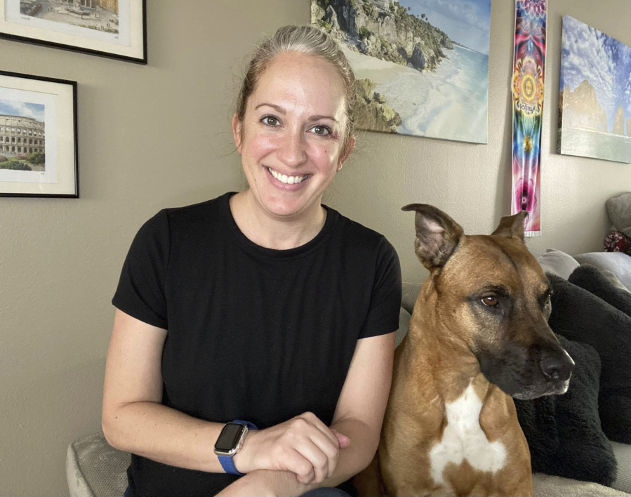 Lindsay Kee, seen Aug. 3 with her dog Teddy Ruffsavel at her home in Portland, created an exercise routine around walking her dog.