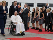 Pope Francis is accompanied by Belgian authorities during the farewell ceremony at Melsbroek Air Base at the end of a four-day visit to Belgium and Luxembourg, Sunday, Sept. 29, 2024.