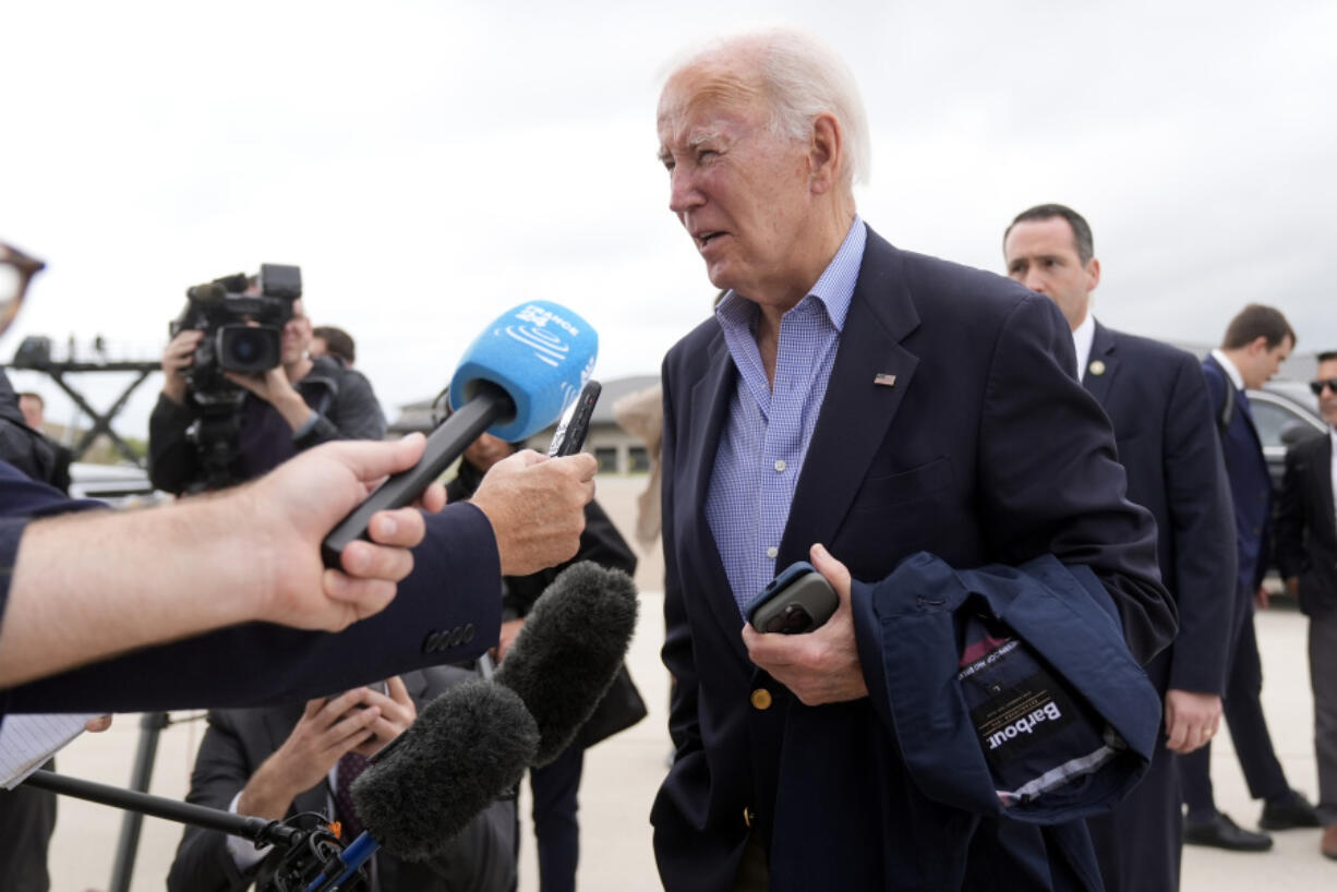 President Joe Biden speaks to reporters before boarding Air Force One at Dover Air Force Base, in Dover, Del., Sunday, Sept. 29, 2024, to return to Washington.