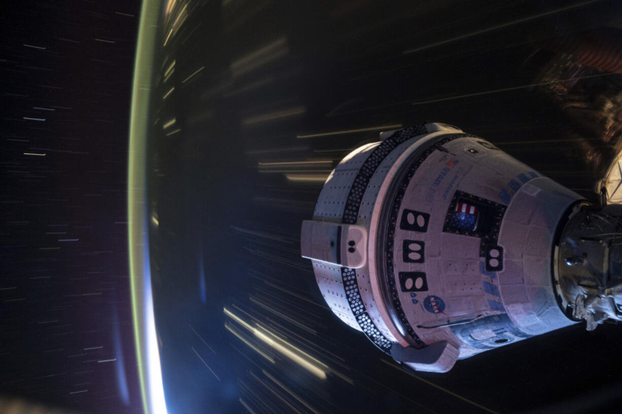 In this long-exposure photo provided by NASA, Boeing&rsquo;s Starliner spacecraft is docked to the Harmony module of the International Space Station on July 3, 2024.