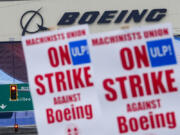 Boeing workers wave picket signs as they strike after union members voted to reject a contract offer, Sunday, Sept. 15, 2024, near the company&#039;s factory in Everett, Wash.