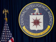 FILE - The seal of the Central Intelligence Agency stands next to a U.S. flag at CIA headquarters in Langley, Va.