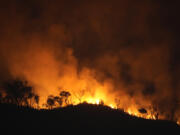 Fires spread through the environmental protection area of Pouso Alto, in Chapada dos Veadeiros National Park, during dry season, in Colinas do Sul, Goias state, Brazil, Monday, Sept. 9, 2024.