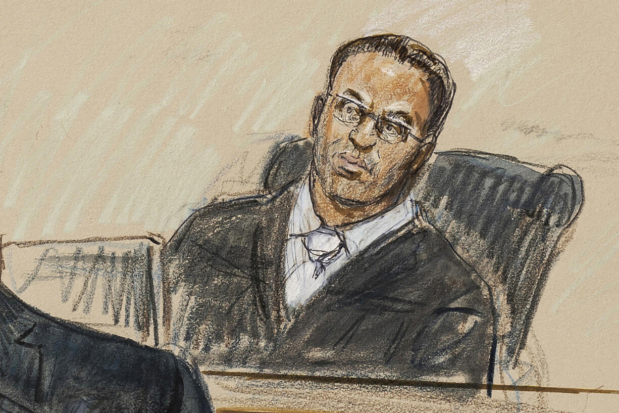 FILE - This artist sketch depicts U.S. District Judge Amit Mehta during a Jan. 6, 2021 trial at the federal courthouse in Washington, Nov. 7, 2022.  Mehta assured Capitol rioter Shane Jenkins that he wasn&rsquo;t getting punished for his political beliefs. Mehta said he was disturbed that Jenkins was selling Jan. 6 merchandise promoting the notion that he and other rioters are political prisoners. He sentenced the Texas man to seven years in prison.