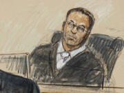 FILE - This artist sketch depicts U.S. District Judge Amit Mehta during a Jan. 6, 2021 trial at the federal courthouse in Washington, Nov. 7, 2022.  Mehta assured Capitol rioter Shane Jenkins that he wasn&rsquo;t getting punished for his political beliefs. Mehta said he was disturbed that Jenkins was selling Jan. 6 merchandise promoting the notion that he and other rioters are political prisoners. He sentenced the Texas man to seven years in prison.