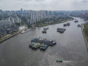 In this photo released by Xinhua News Agency, an aerial view shows boats docking near a harbor after the State Flood Control and Drought Relief Headquarters raised its emergency response for flood and typhoon prevention for Typhoon Yagi, in Haikou, south China&rsquo;s Hainan Province on Sept. 4, 2024.