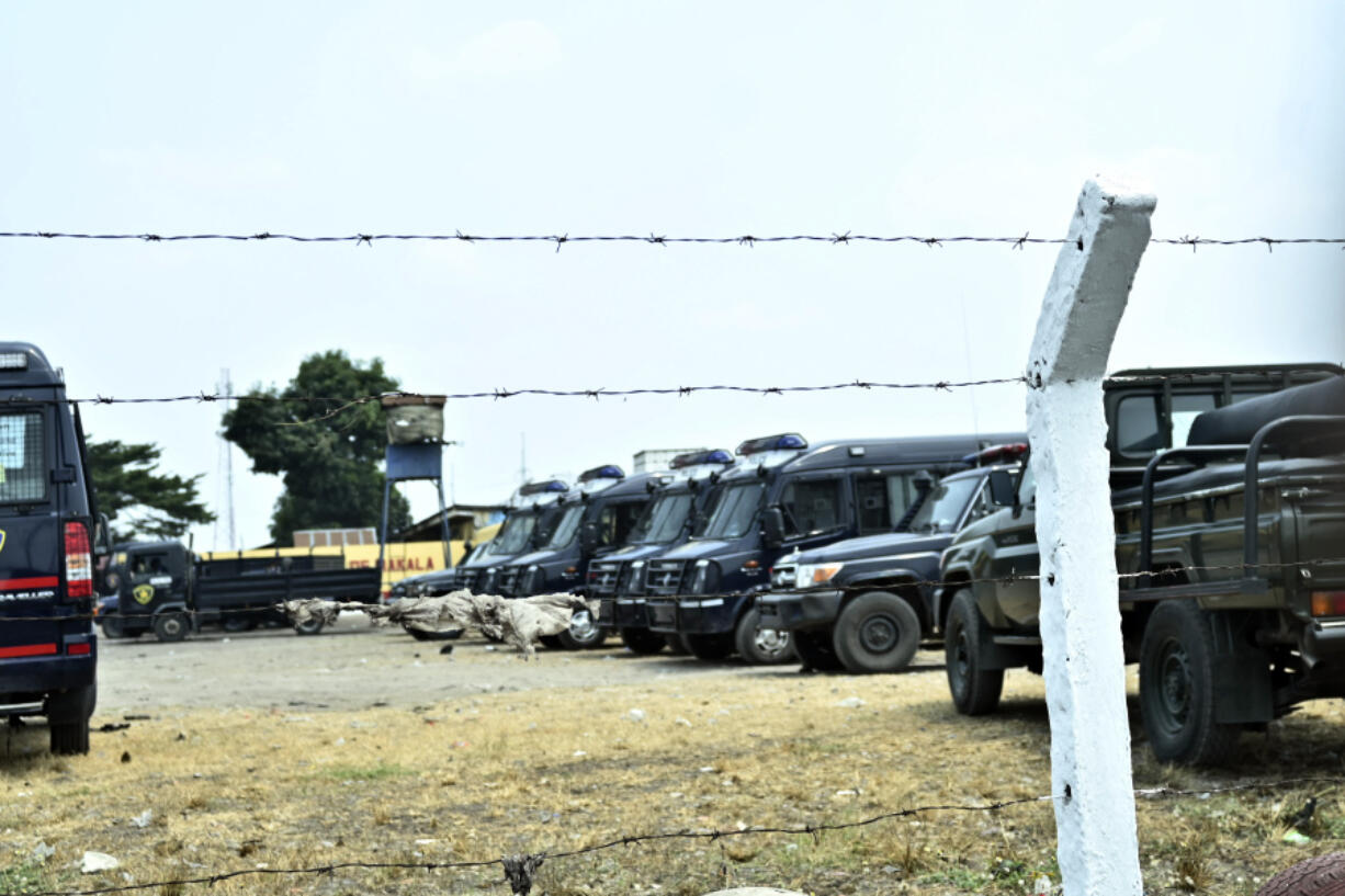 Police vehicles are seen outside the Makala Central prison in Kinshasa, Congo, Tuesday, Sept. 3, 2024 after an attempted jailbreak in Congo&rsquo;s main prison that left many people dead.