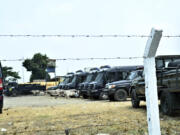 Police vehicles are seen outside the Makala Central prison in Kinshasa, Congo, Tuesday, Sept. 3, 2024 after an attempted jailbreak in Congo&rsquo;s main prison that left many people dead.