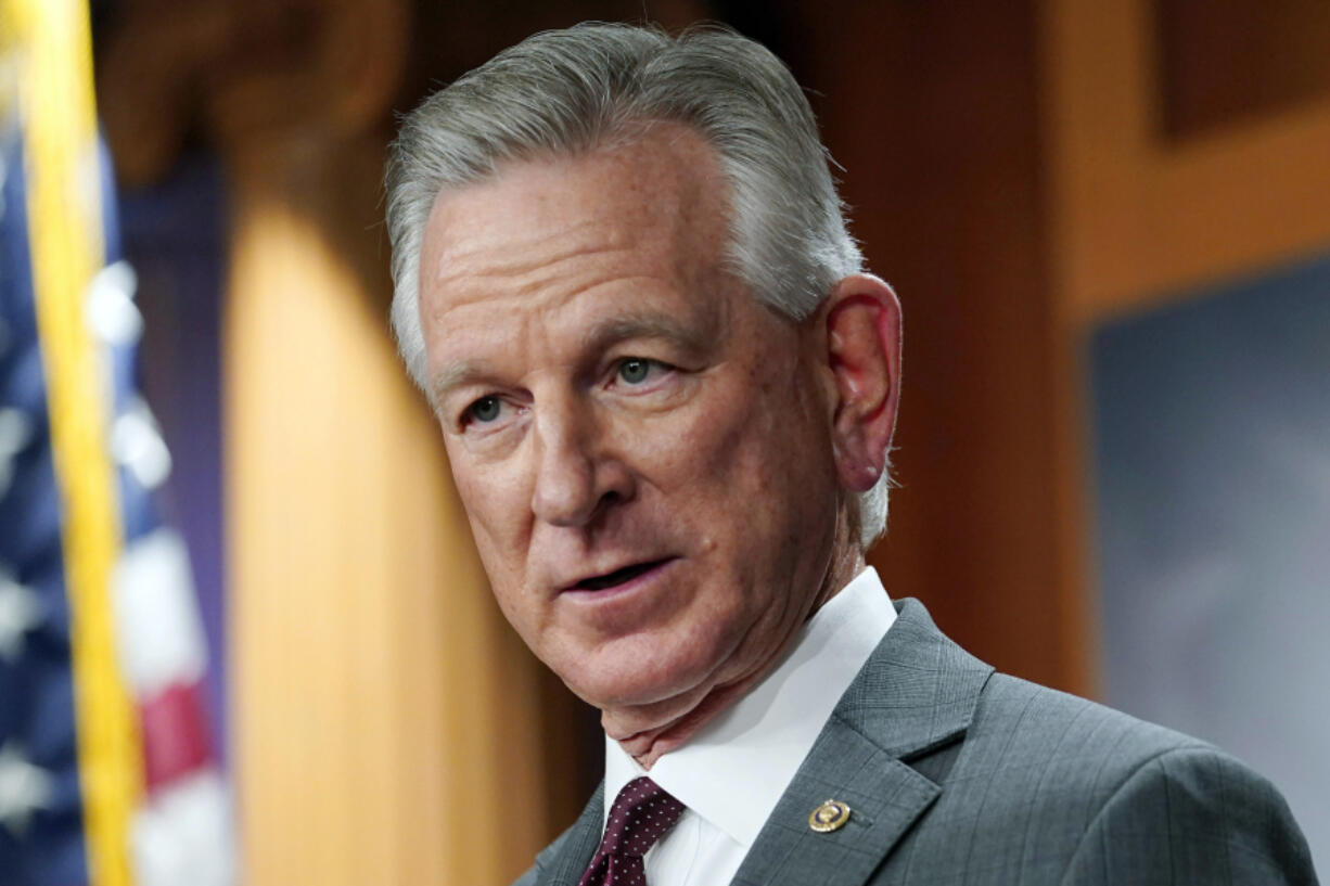 FILE - Sen. Tommy Tuberville, R-Ala., listens to a question during a news conference, March 30, 2022, in Washington.  Tuberville is blocking the quick promotion of an aide to Defense Secretary Lloyd Austin. Tuberville is blocking the nomination of Lt. Gen Ron Clark over concerns that he and other senior staff did not quickly notify President Joe Biden when Austin was hospitalized with complications from cancer treatment earlier this year.