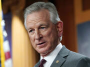 FILE - Sen. Tommy Tuberville, R-Ala., listens to a question during a news conference, March 30, 2022, in Washington.  Tuberville is blocking the quick promotion of an aide to Defense Secretary Lloyd Austin. Tuberville is blocking the nomination of Lt. Gen Ron Clark over concerns that he and other senior staff did not quickly notify President Joe Biden when Austin was hospitalized with complications from cancer treatment earlier this year.