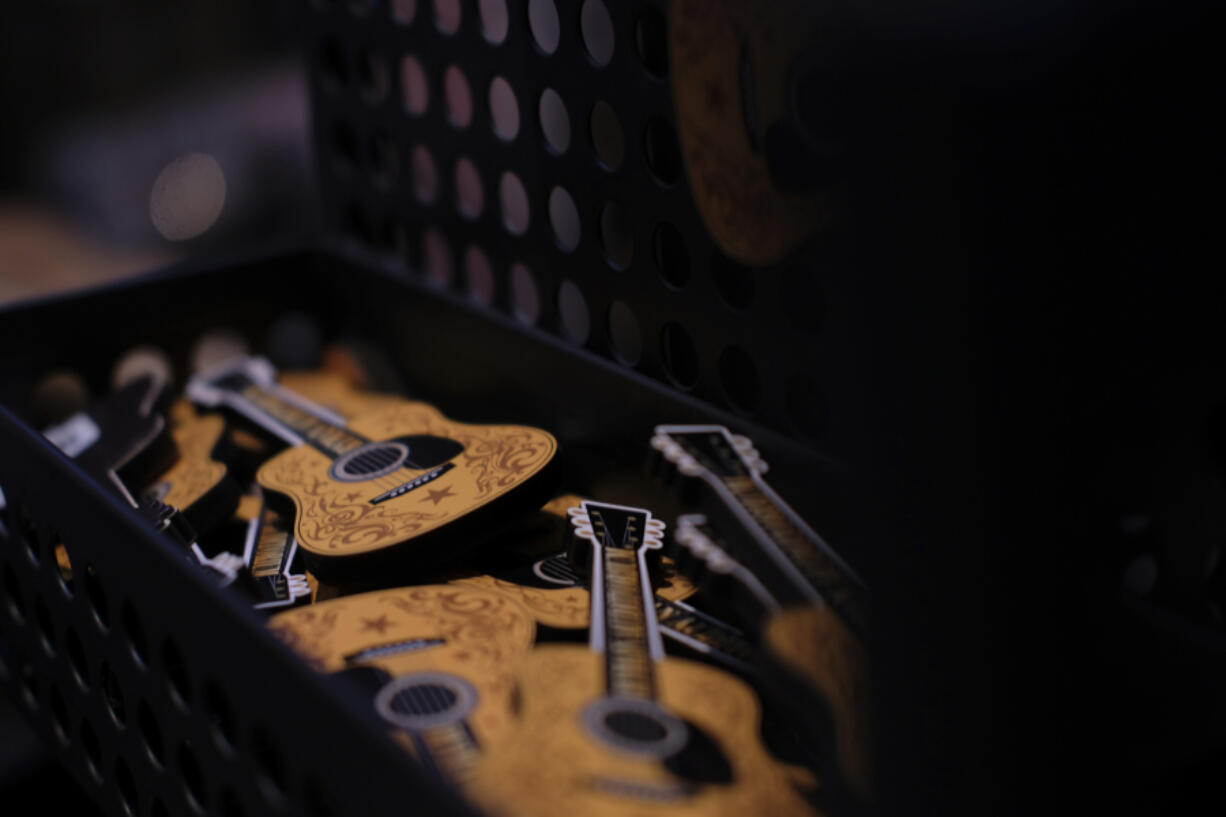 Guitar magnets are displayed at the Ryman Auditorium gift shop in Nashville, Tenn., on July 30, 2024.