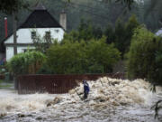 Debris collects on a small overpath on the Opavice River near Krnov, Czech Republic, Saturday, Sept. 14, 2024.