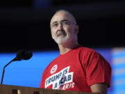 Shawn Fain, president of the United Automobile Workers, speaks during the Democratic National Convention Monday, Aug. 19, 2024, in Chicago.