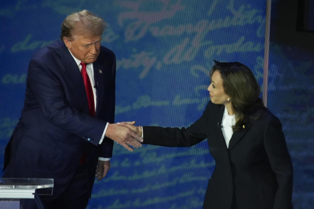 Republican presidential nominee former President Donald Trump shakes hands with Democratic presidential nominee Vice President Kamala Harris during an ABC News presidential debate at the National Constitution Center, Tuesday, Sept.10, 2024, in Philadelphia.