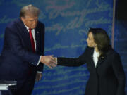 Republican presidential nominee former President Donald Trump shakes hands with Democratic presidential nominee Vice President Kamala Harris during an ABC News presidential debate at the National Constitution Center, Tuesday, Sept.10, 2024, in Philadelphia.