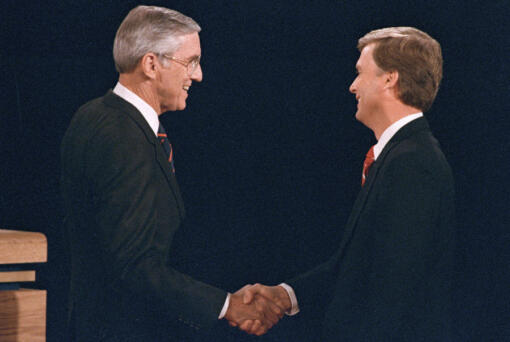 FILE - Sen. Lloyd Bentsen, D-Texas, left, shakes hands with Sen. Dan Quayle, R-Ind., before the start of their vice presidential debate at the Omaha Civic Auditorium, Omaha, Neb., Oct. 5, 1988.