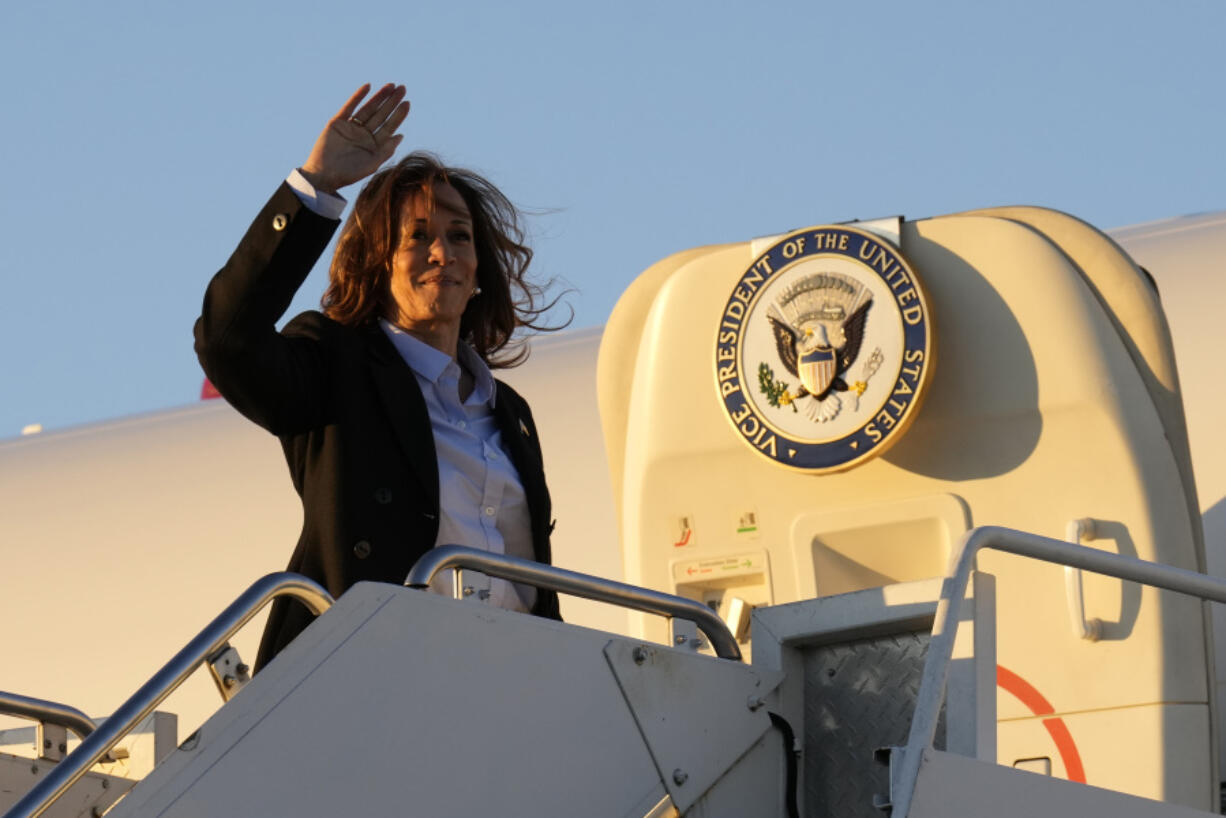 Democratic presidential nominee Vice President Kamala Harris waves as she boards Air Force Two at Pittsburgh International Airport in Pittsburgh, Monday, Sept. 2, 2024.