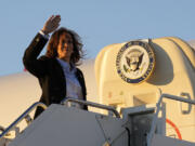 Democratic presidential nominee Vice President Kamala Harris waves as she boards Air Force Two at Pittsburgh International Airport in Pittsburgh, Monday, Sept. 2, 2024.