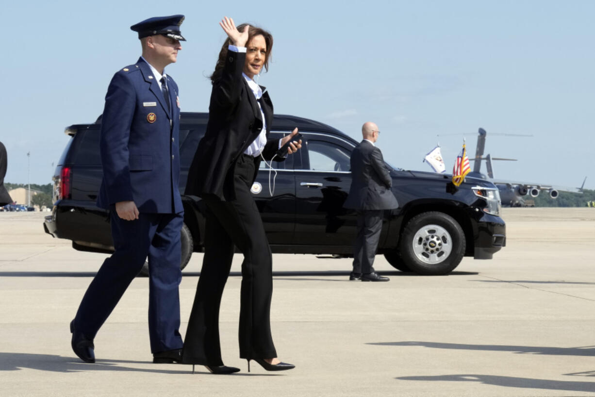 Democratic presidential nominee Vice President Kamala Harris waves as she boards Air Force Two to travel to Detroit and Pittsburgh for campaign events, at Joint Base Andrews, Md., Monday Sept. 2, 2024.