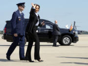 Democratic presidential nominee Vice President Kamala Harris waves as she boards Air Force Two to travel to Detroit and Pittsburgh for campaign events, at Joint Base Andrews, Md., Monday Sept. 2, 2024.