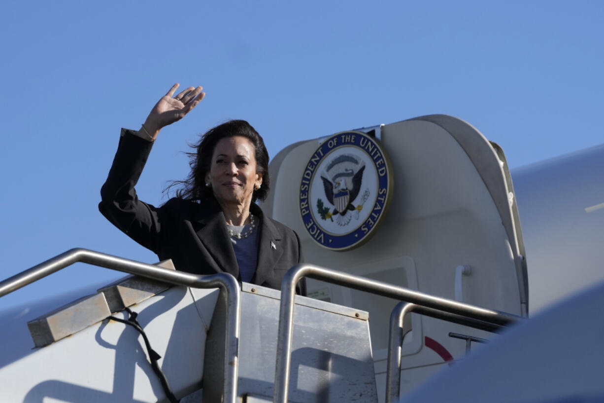 Democratic presidential nominee Vice President Kamala Harris waves while boarding Air Force Two in San Francisco, Saturday, Sept. 28, 2024.