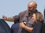 Democratic presidential nominee Vice President Kamala Harris arrives in Pittsburgh International Airport, in Coraopolis, Pa., Thursday, Sept. 5, 2024, and takes a selfie with Sen. John Letterman, D-Pa.