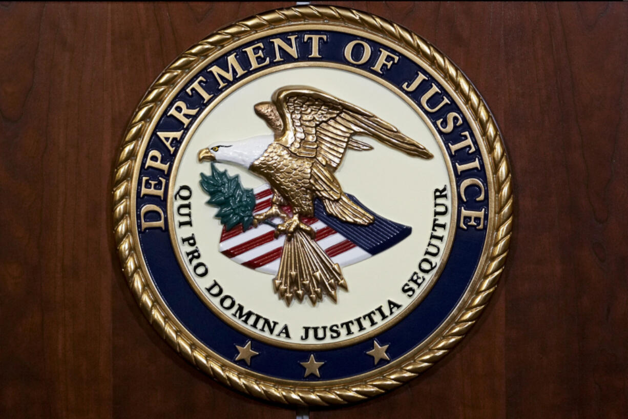 FILE - The seal of the Department of Justice, Aug. 1, 2023, at the Department of Justice in Washington. (AP Photo/J.