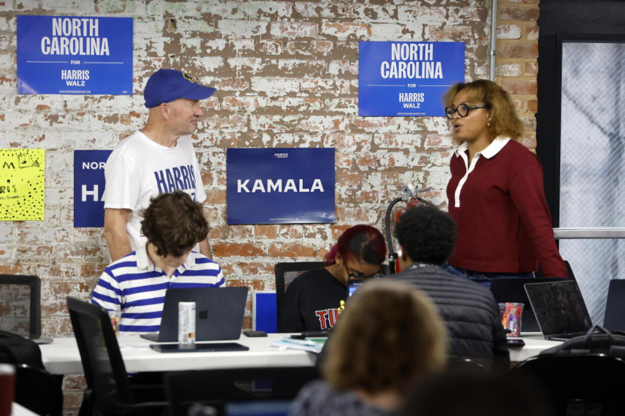 Volunteers and staff work at a democratic phone bank in Raleigh, N.C., Tuesday, Sept. 24, 2024.