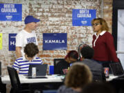 Volunteers and staff work at a democratic phone bank in Raleigh, N.C., Tuesday, Sept. 24, 2024.