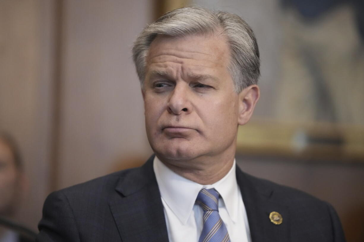 FBI Director Christopher Wray listens during a meeting of the Justice Department&#039;s Election Threats Task Force at the Department of Justice, Wednesday, Sept. 4, 2024, in Washington.