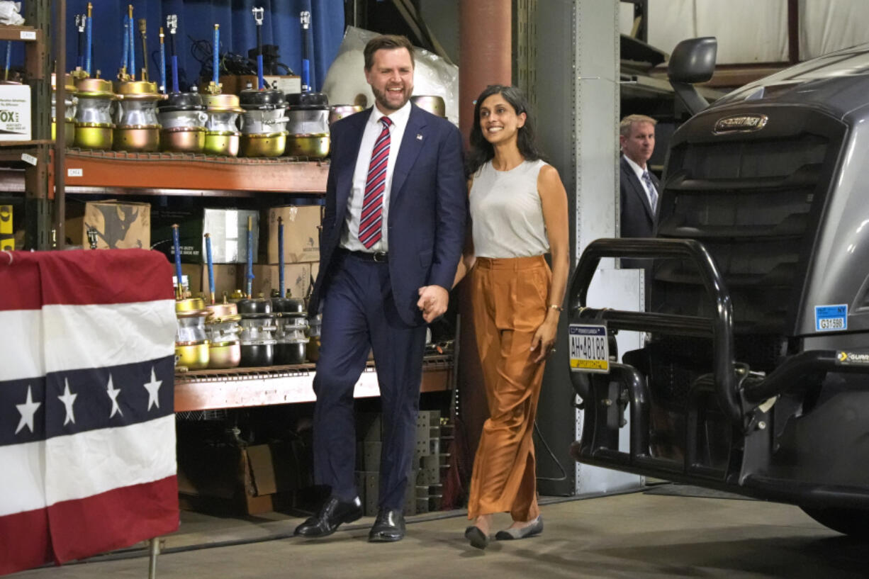 Republican vice presidential nominee Sen. JD Vance, R-Ohio, left, and his wife, Usha, arrive at a campaign event Aug. 28 in Erie, Pa. (Gene J.