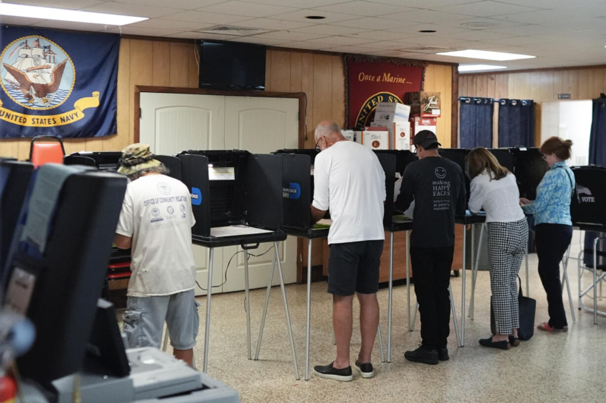 FILE - Voters fill in their ballots for Florida&#039;s primary election in South Miami, Fla., Aug. 20, 2024.