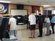 FILE - Voters fill in their ballots for Florida&#039;s primary election in South Miami, Fla., Aug. 20, 2024.