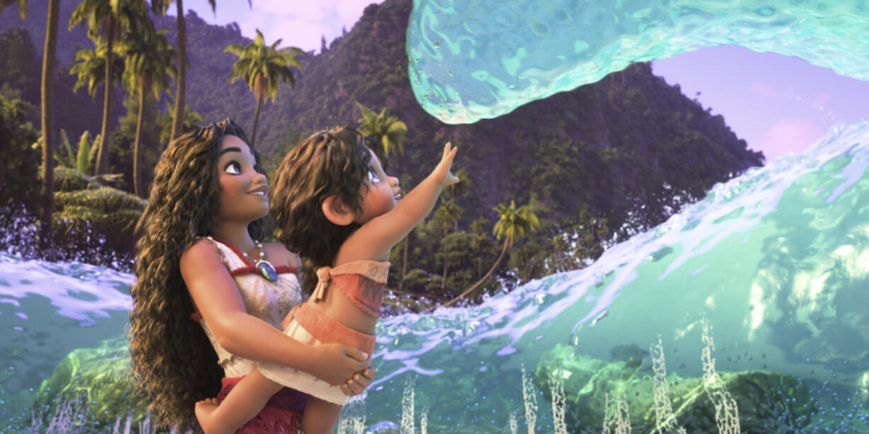 Moana, voiced by Auli&rsquo;i Cravalho, holding Simea, voiced by Khaleesi Lambert-Tsuda, in a scene from &ldquo;Moana 2.&rdquo; (Disney)