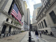 FILE - American flags hang from the front of the New York Stock Exchange on Sept. 11, 2024, in New York.